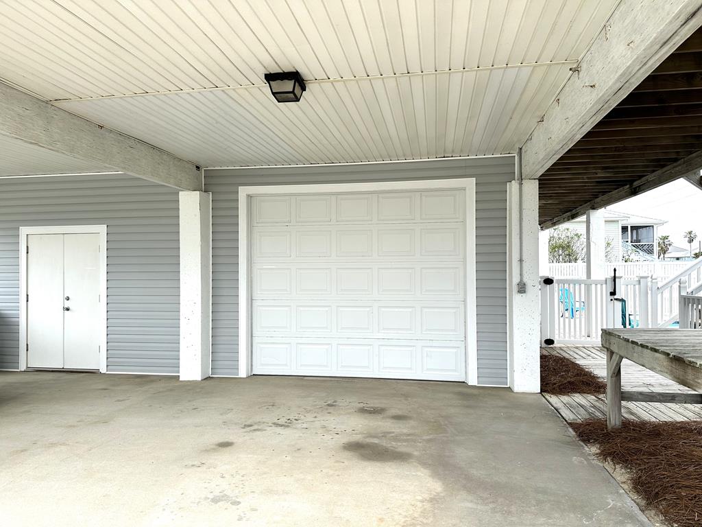 Two entrances to large ground level garage.